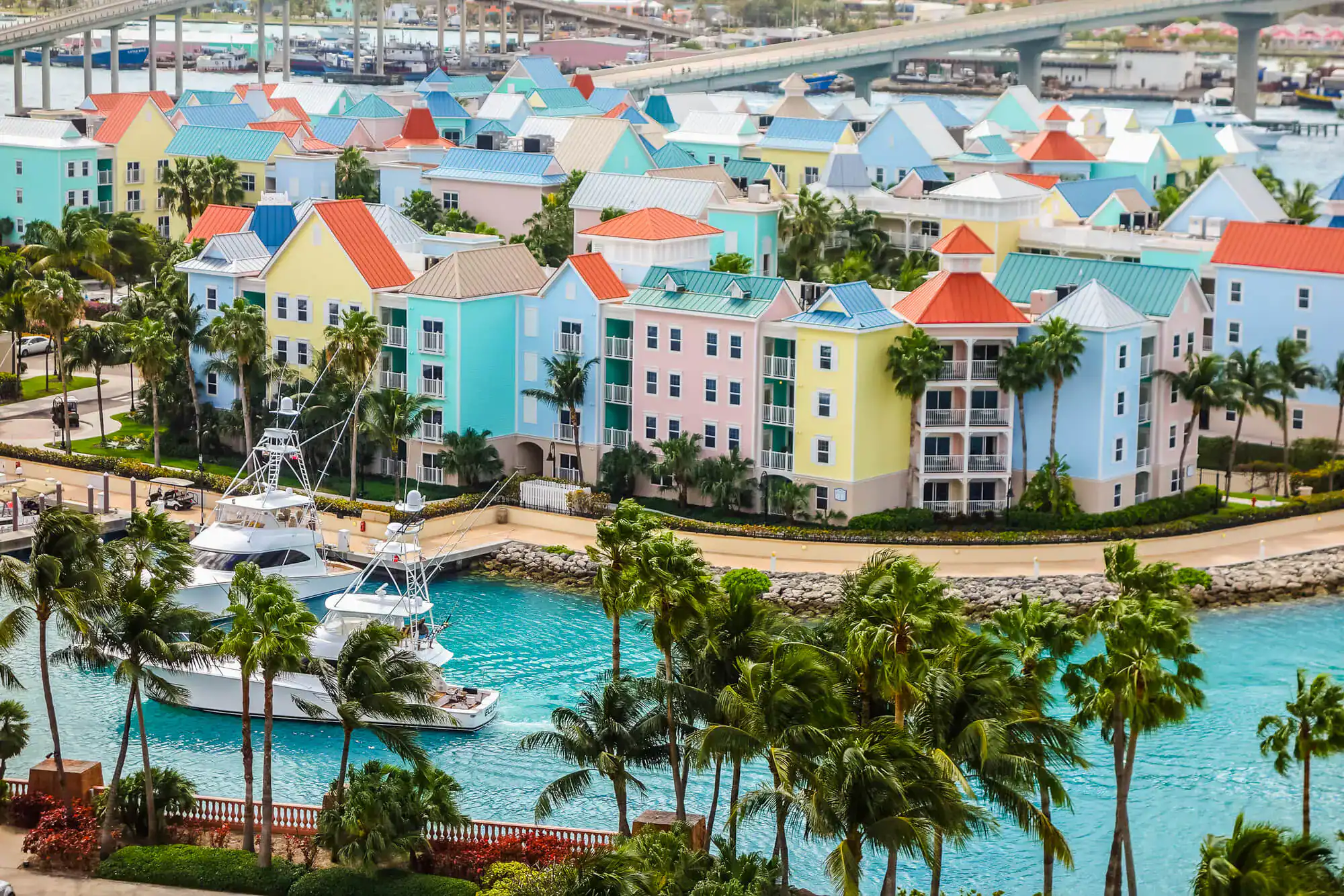 Pastel waterfront villas and moored boats in Nassau, The Bahamas